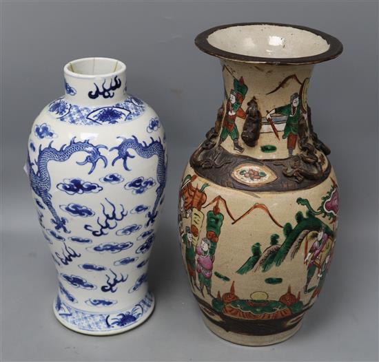 A Chinese famille rose crackle glaze vase and a Chinese blue and white dragon vase, tallest 34cm
